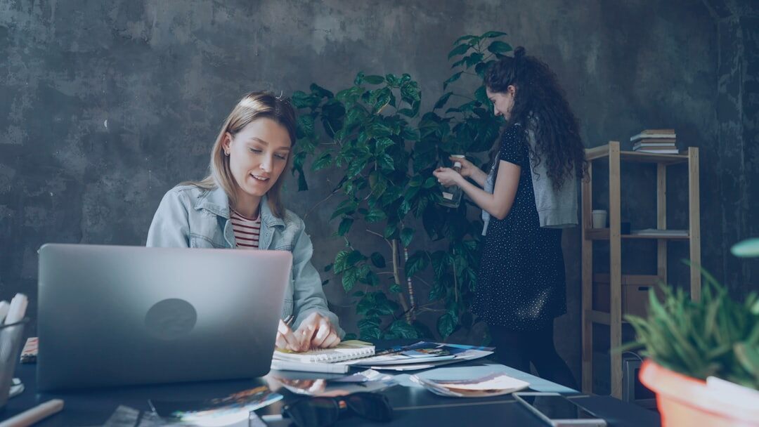 Startup team working in modern office with laptops